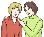 Eine Frau tröstet eine andere Frau