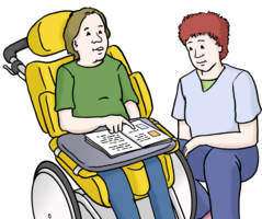 Mann im Rollstuhl zeigt auf ein Bild in einem Heft.